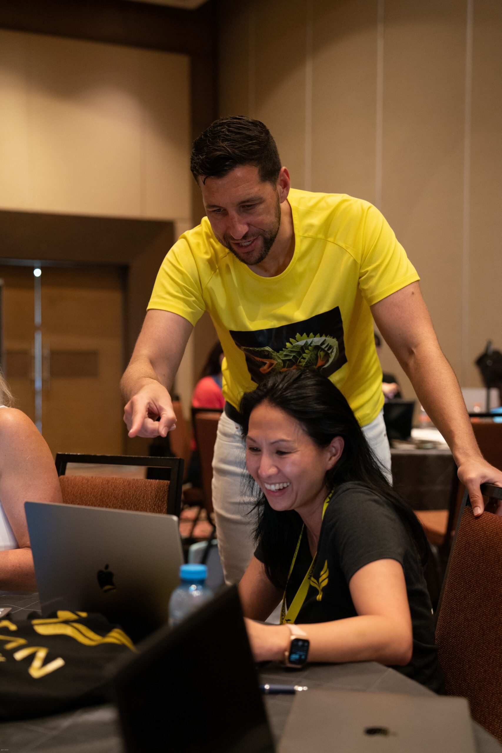 Professional coaching session with mentor guiding client during Titan 2023 event, Day 4, fostering growth and success.